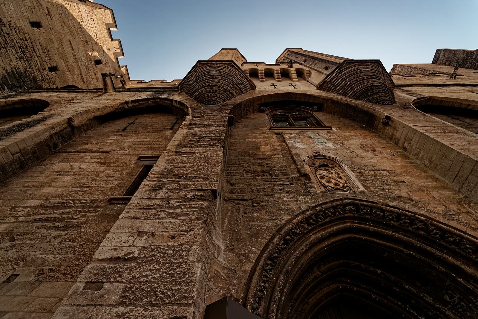 Avignon - Place du Palais - View Up at the Museum Entrance to Palais des Papes - Gothic 14th Century architecture - Largest Gothic building of the Middle Ages